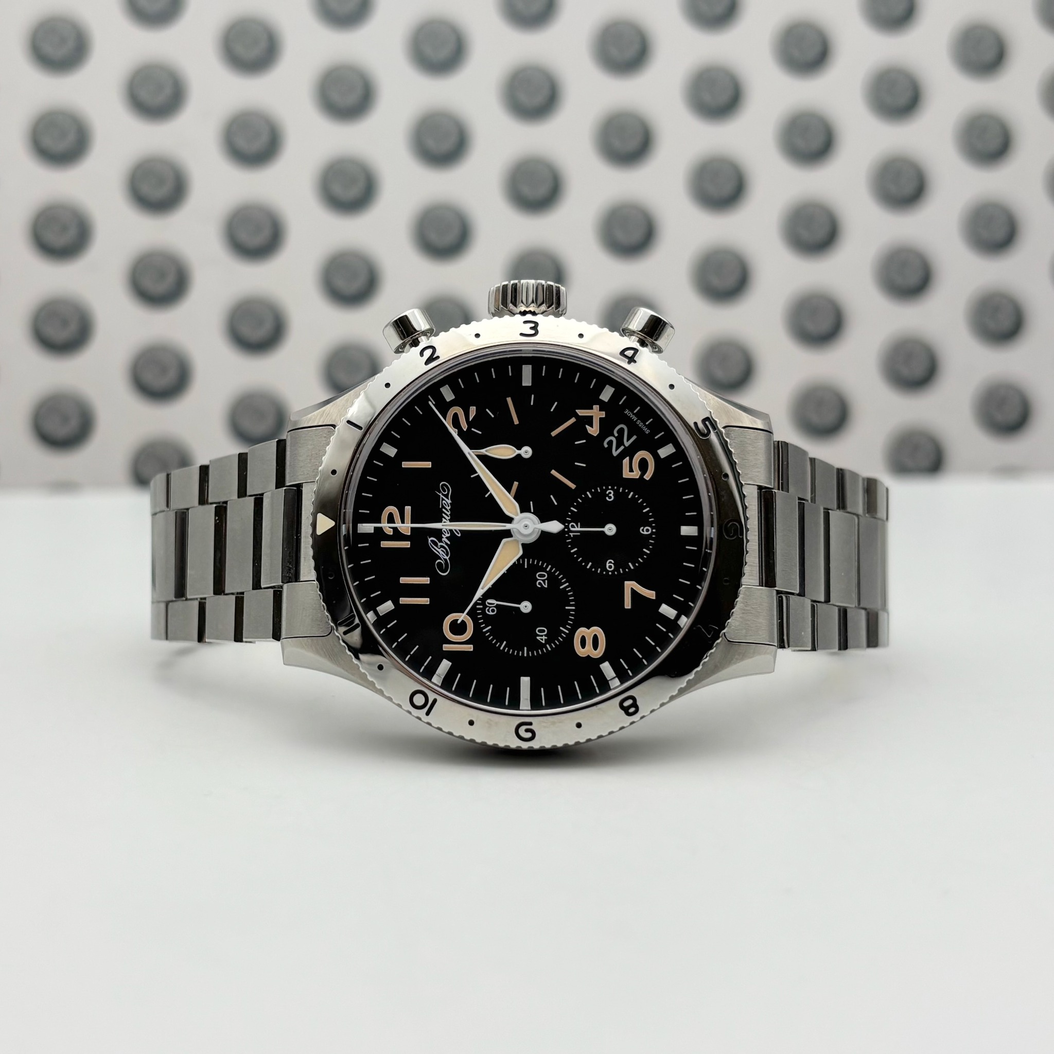 May be an image of wrist watch and text