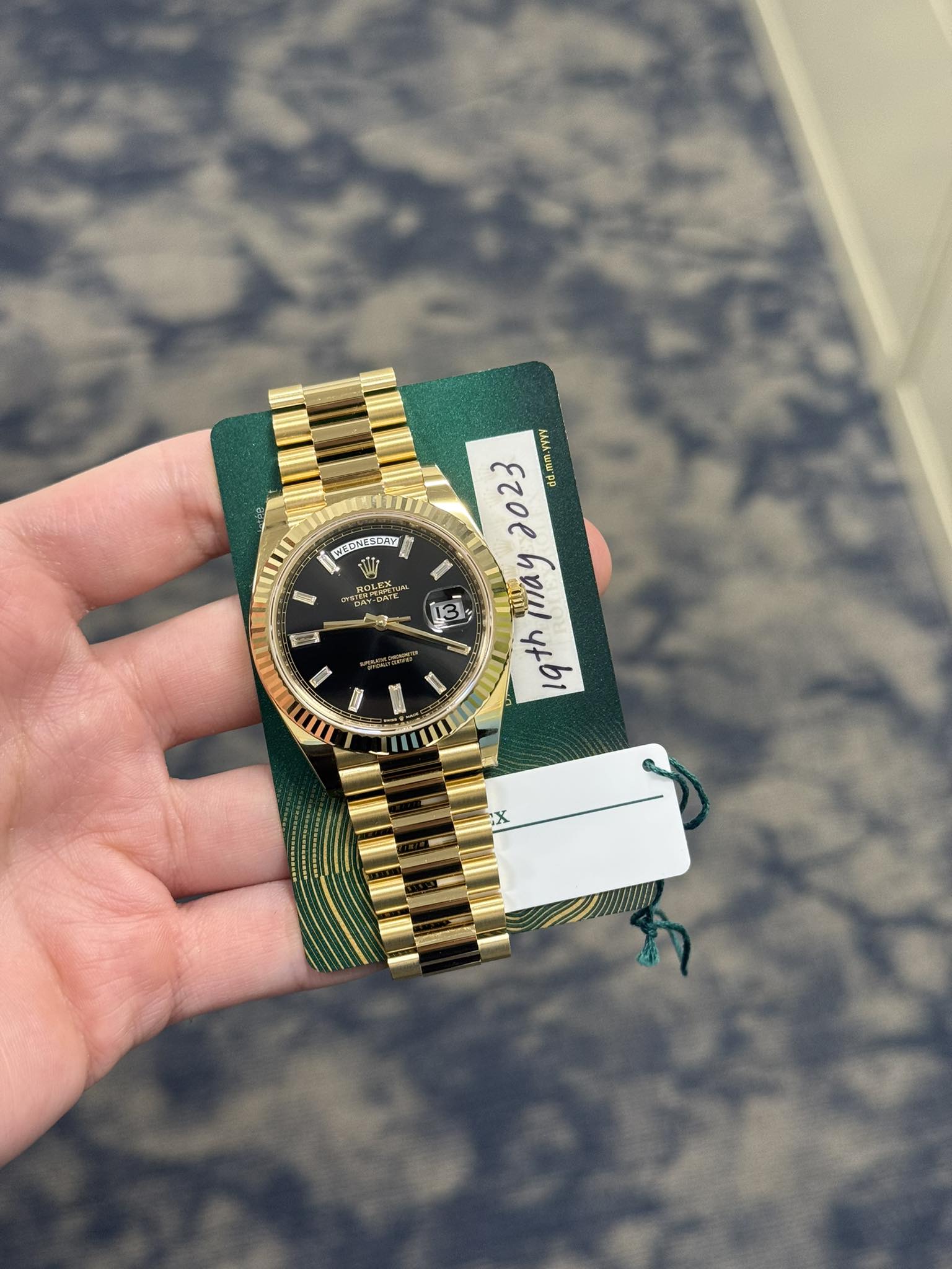 May be an image of wrist watch and text