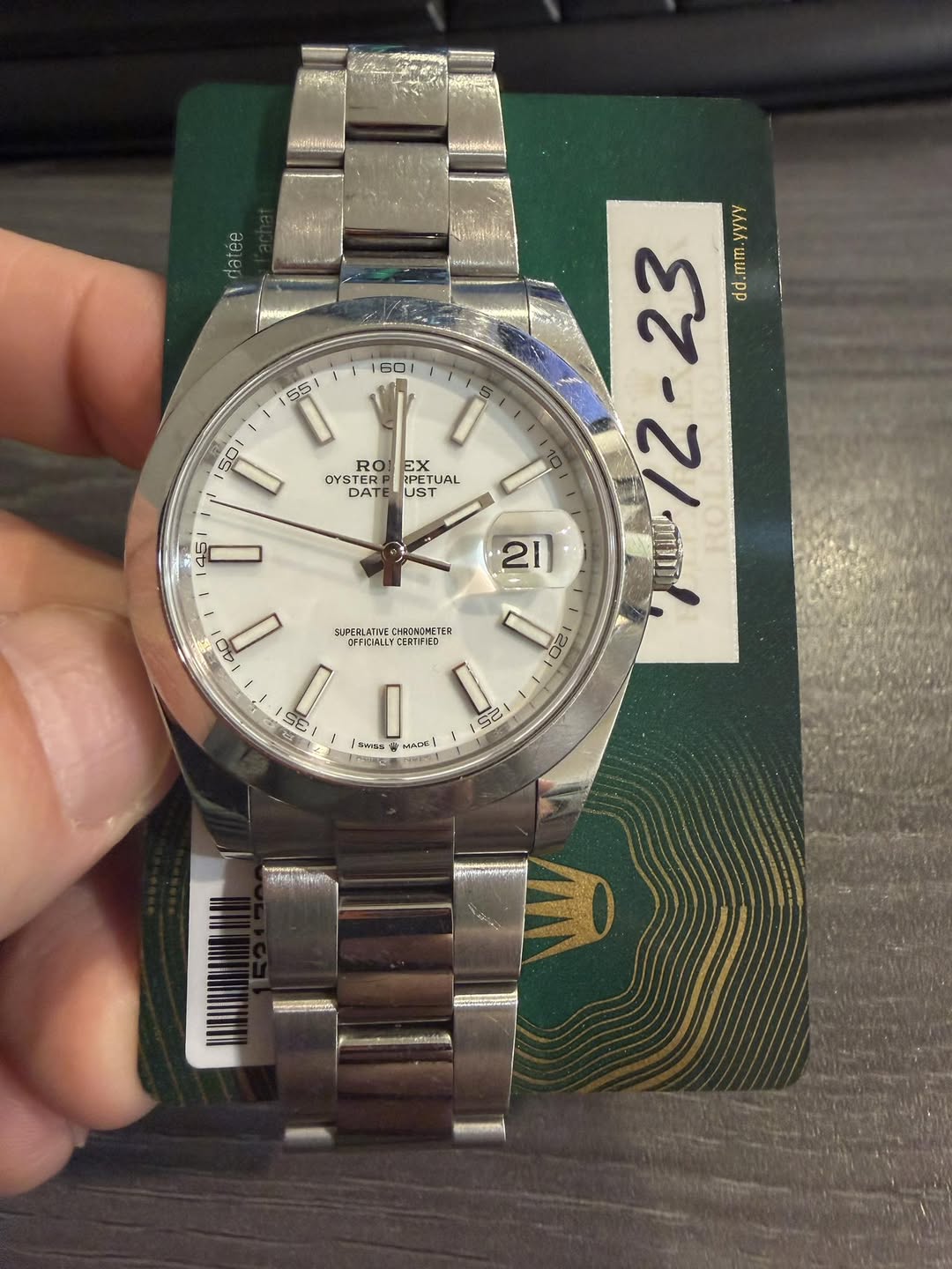 May be an image of wrist watch and text