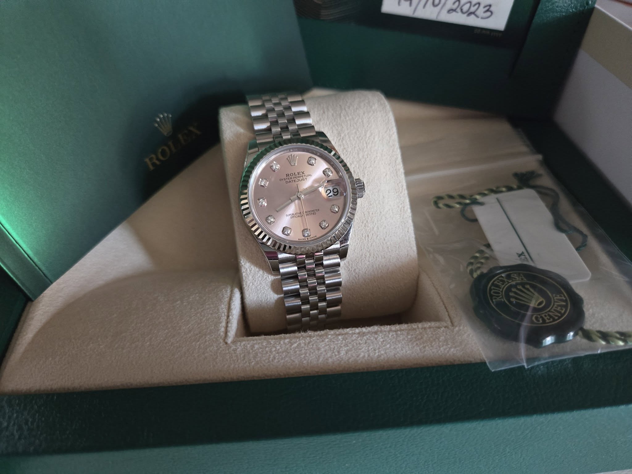 May be an image of wrist watch and text