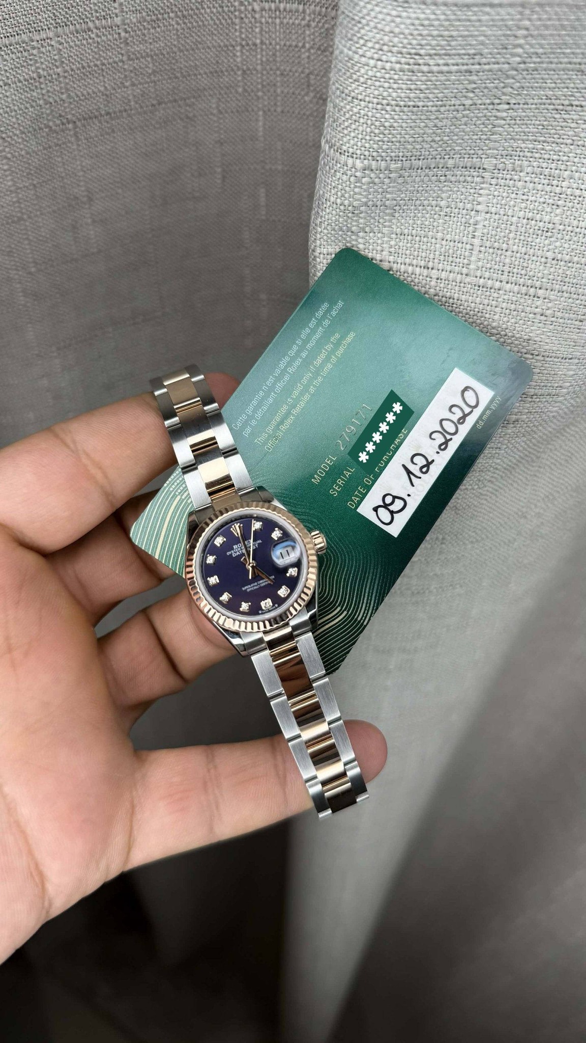 May be an image of wrist watch and text