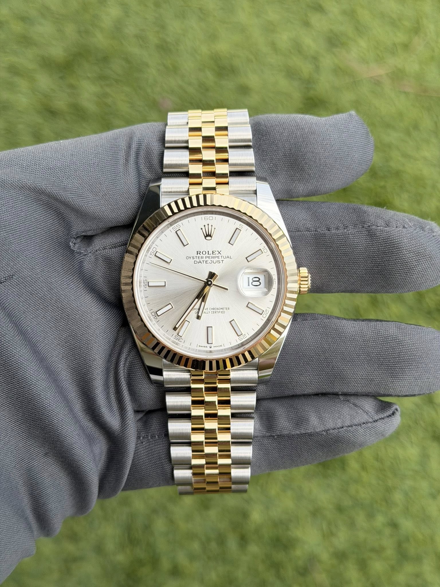 May be an image of wrist watch and text