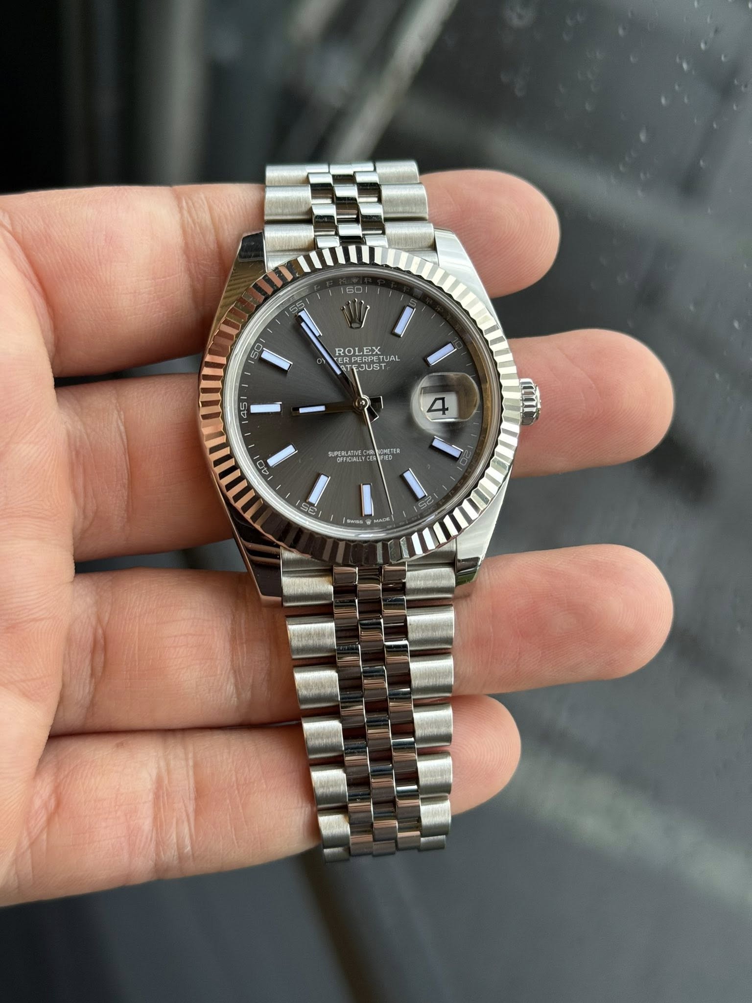 May be an image of wrist watch and text