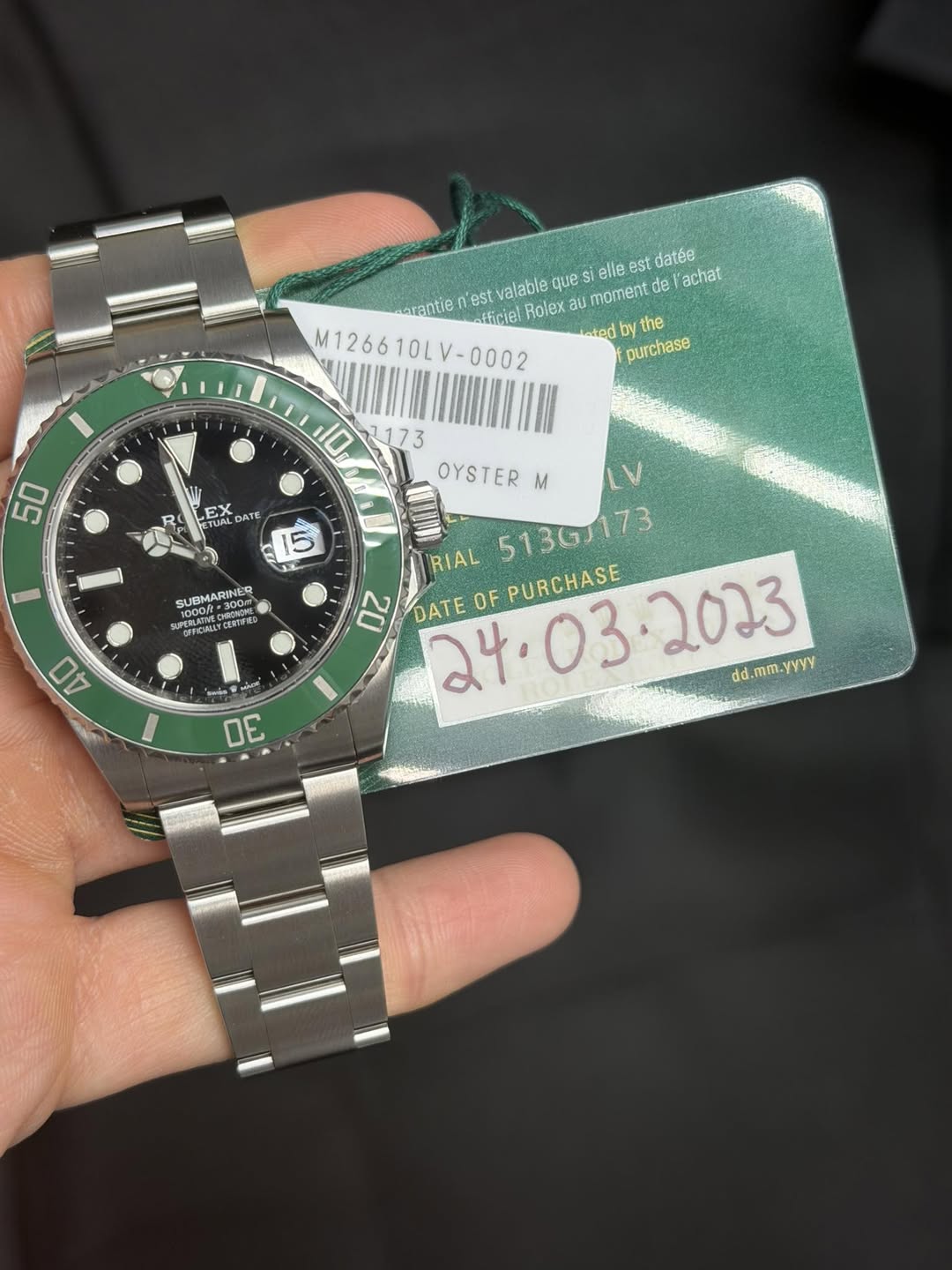 May be an image of wrist watch and text that says 'erantie -fficiel Rolex momentde de achat est valable que elle es est datée M126610LV-000 V- -0002 M126610 eted the purchase 50…