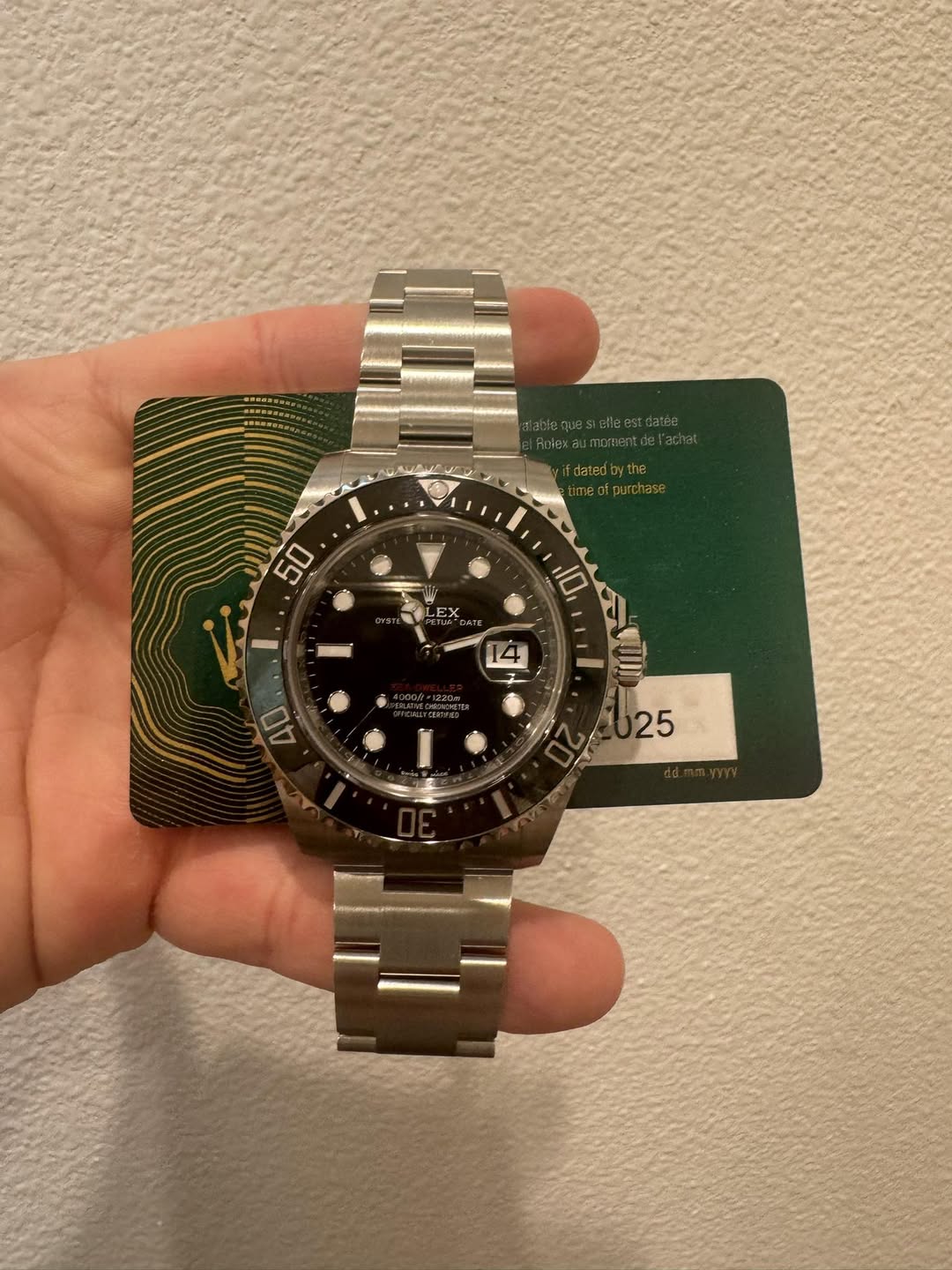 May be an image of wrist watch and text