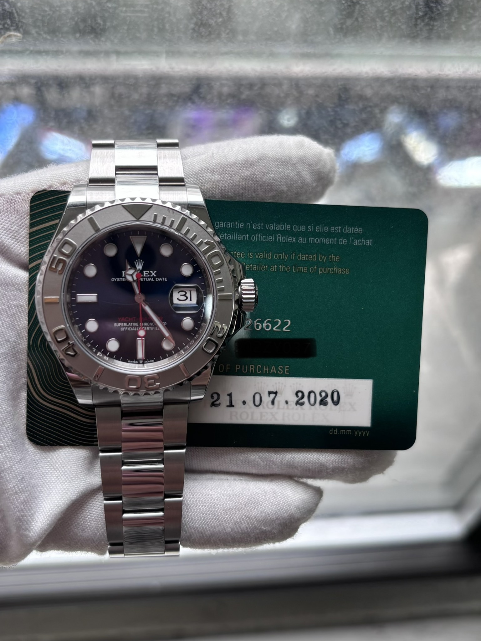 May be an image of wrist watch and text that says 'EX 31 SUPERLATIE 126622 I ROLEXROE'