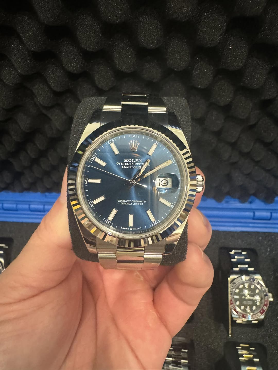 May be an image of wrist watch and text
