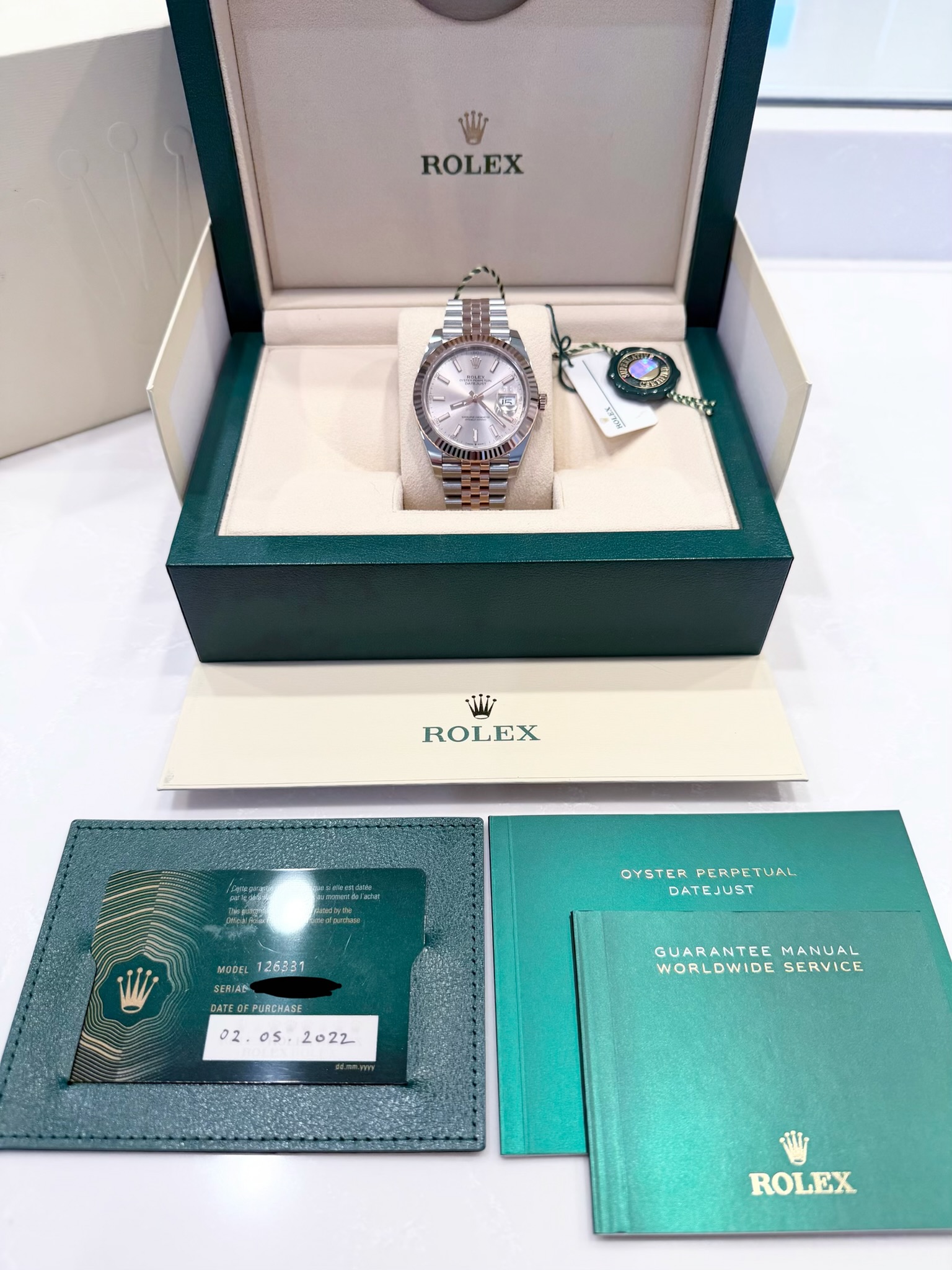 May be an image of wrist watch and text that says 'ROLEX 5 ROLEX Sedondaa OYSTER OYSTERPERPETUAL PERPETUAL DATEJUST MODEL 126331 SERIAS SERIAS DATEOFPORCHASE GUARANTEE…