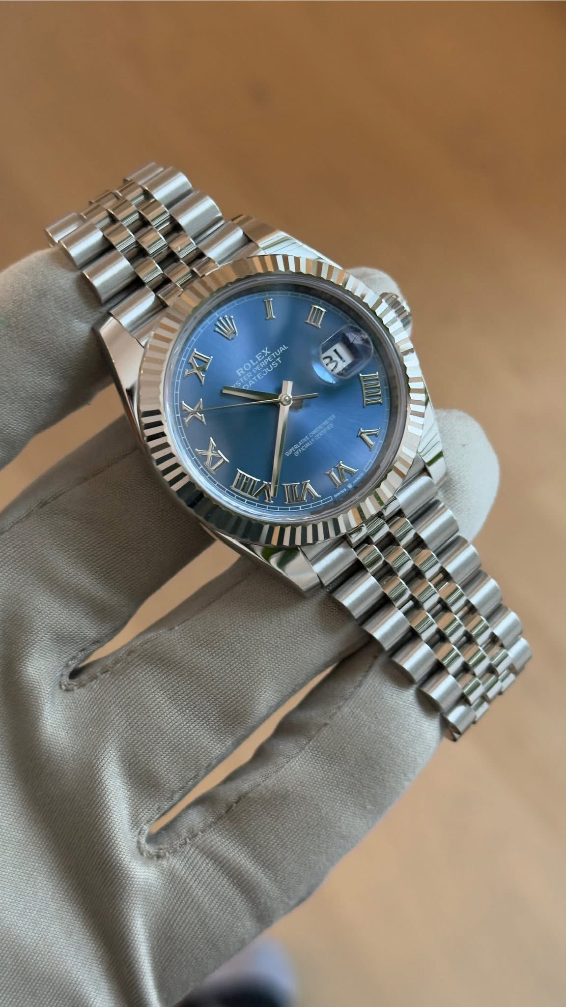 May be an image of wrist watch and text