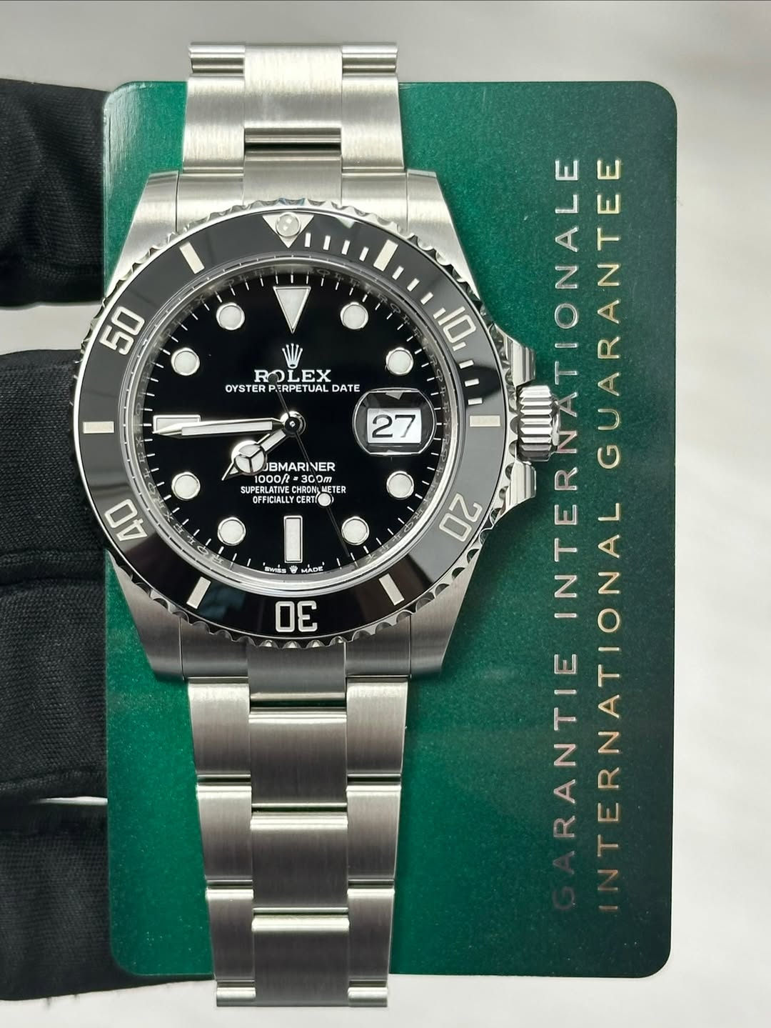 May be an image of wrist watch and text that says '50 27 BMARINER INER 1000ft UPERLATIVE HRONL OFFICIALLYCERTI ETER 40 合H医E ン MADE 30 10 ROLEX EX RO OYSTER YSTERPERPETUAL ETUAL…