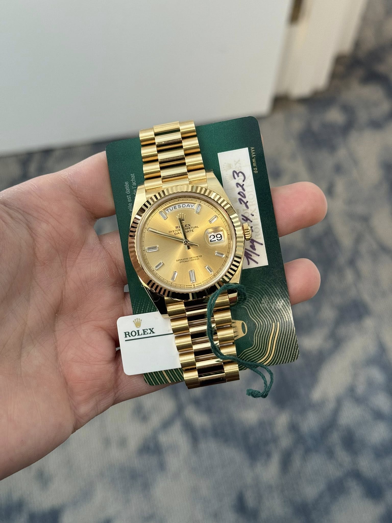 May be an image of wrist watch and text