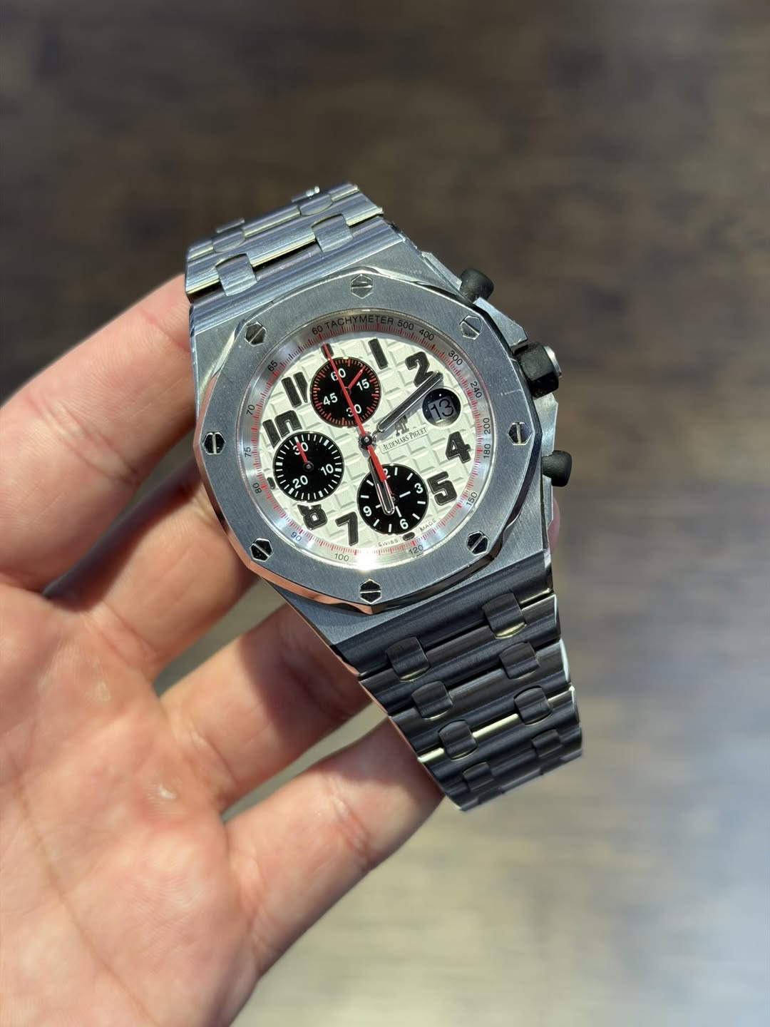 May be an image of wrist watch and text