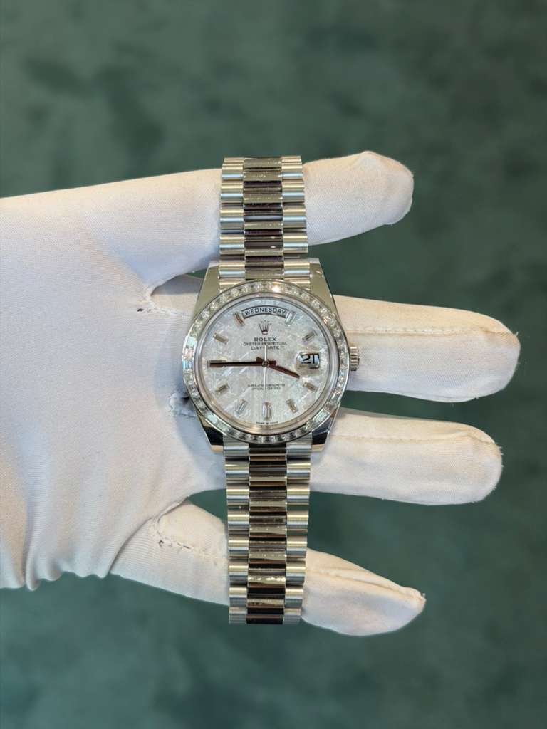 May be an image of wrist watch and text