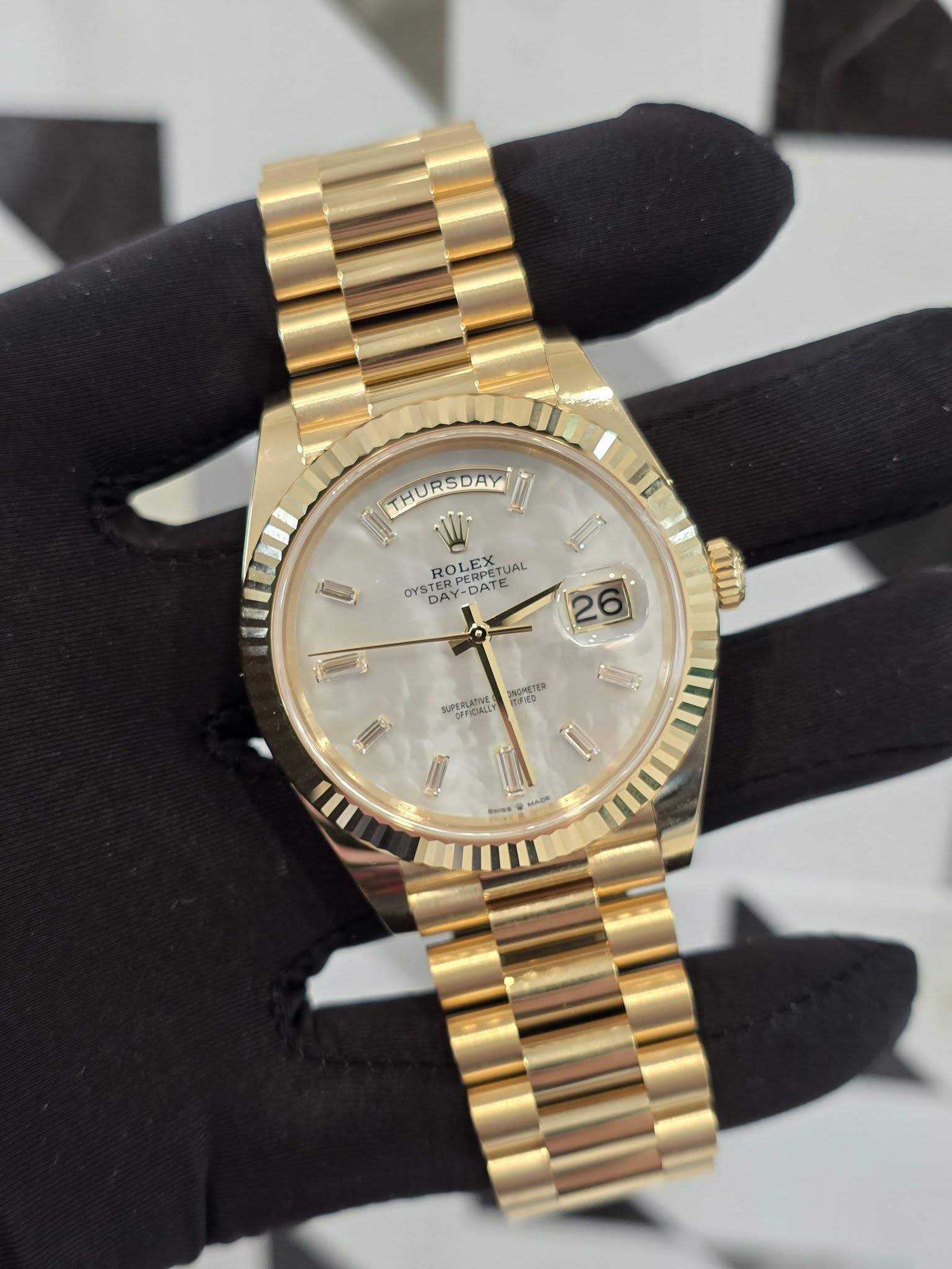 May be an image of wrist watch and text