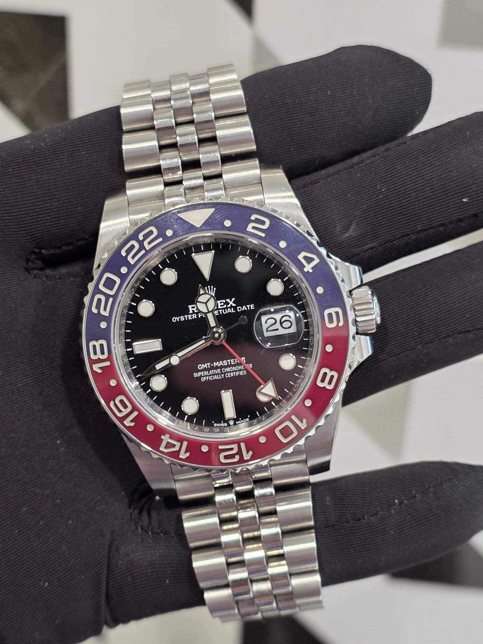 May be an image of wrist watch and text