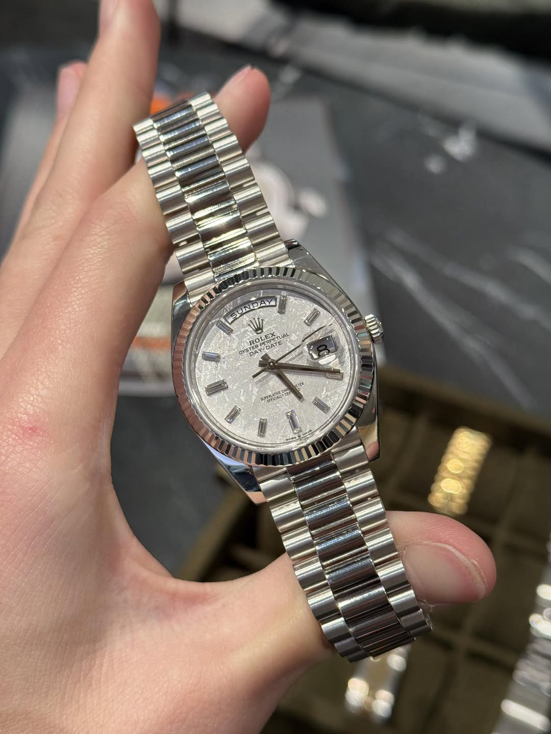 May be an image of wrist watch and text