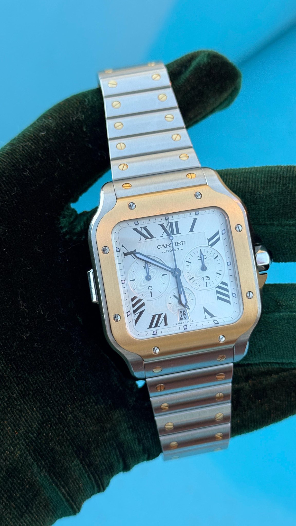 May be an image of wrist watch and text