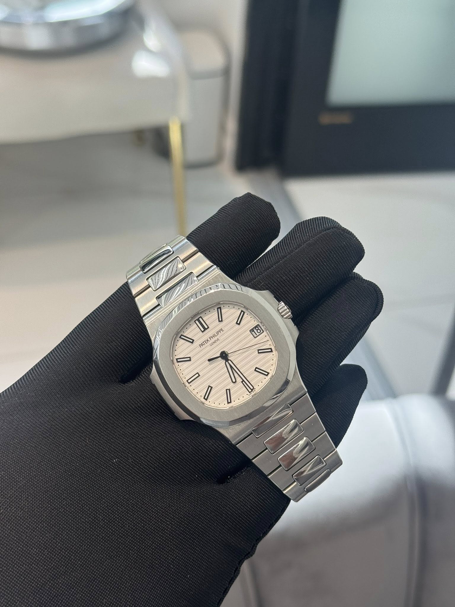 May be an image of wrist watch and text