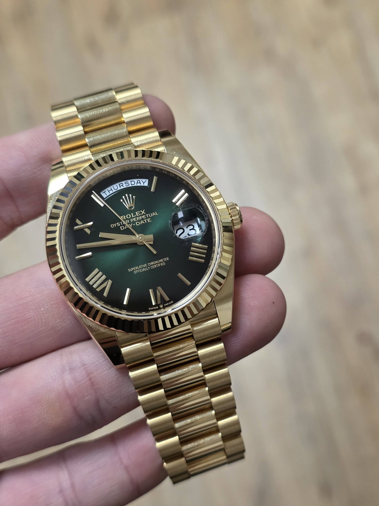 May be an image of wrist watch and text