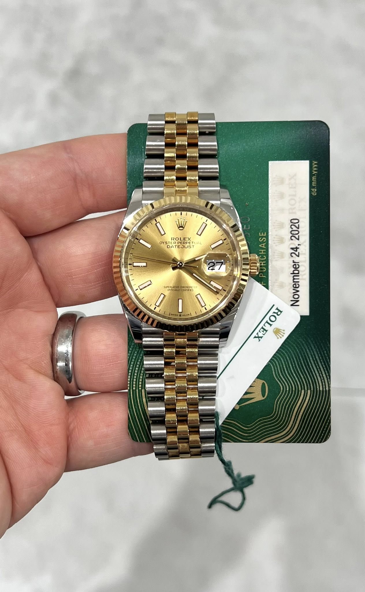 May be an image of wrist watch and text that says 'W ROLE 美 ម i STEMDE ਸলর PO VVYY ROLEX 2020 24, 24, November ባ URCHASE ن D L اح M'