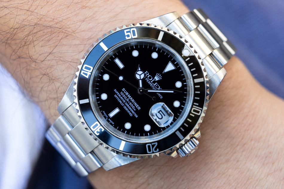 May be an image of wrist watch and text that says '50 40 ROLE PERPE CE OFFICIALLY ERUO 1000/CHBO PERLATIVE PEDLTITE PERLATIVECHRONOMETE 1000/t#300m 1000ft=300m SUBMARINER…