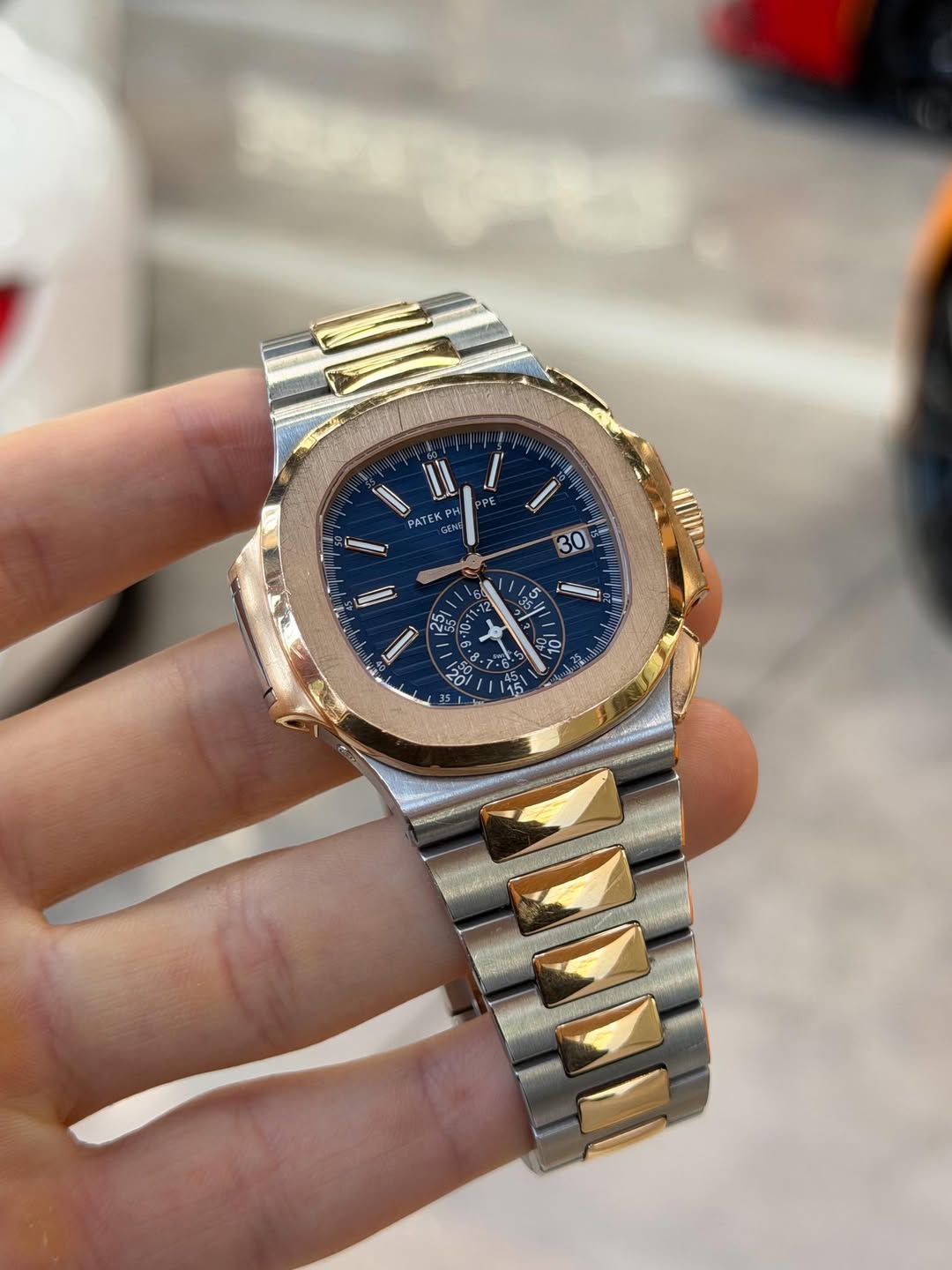 May be an image of wrist watch and text