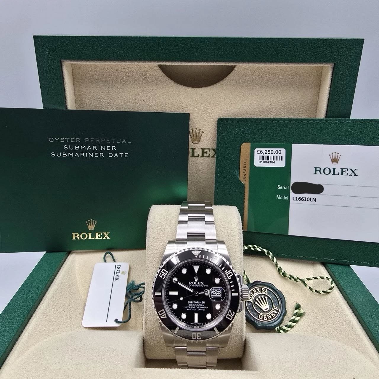 May be an image of wrist watch and text that says '1 SUBMARINER SUBMARINER SUBMARINERDATE DA DATE LE £6, COOU EEUMUUUL 0L-U Seriel ROLEX Model 116610LN ROLEX POE 50 10 ROLEX 26…