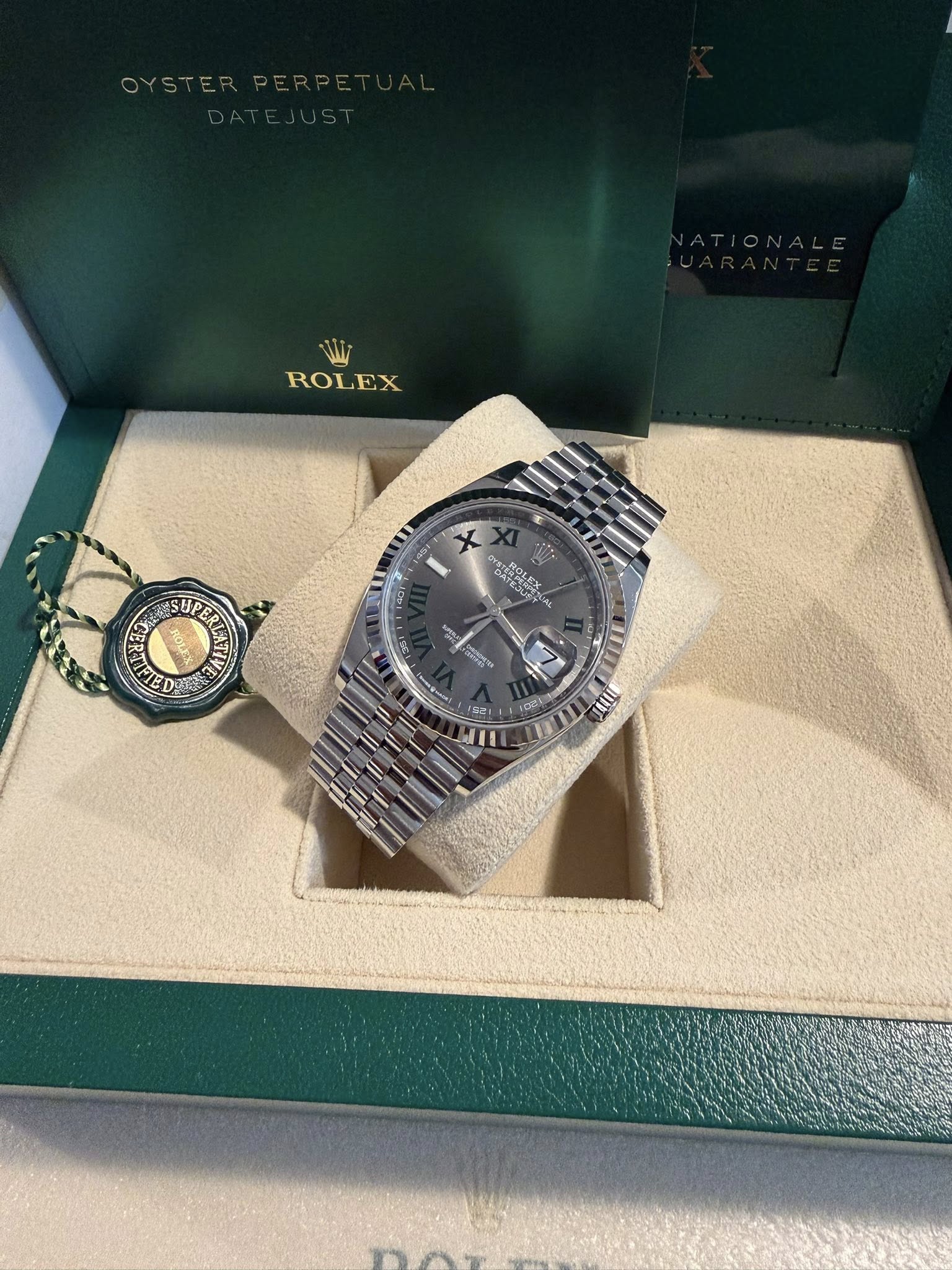 May be an image of wrist watch and text
