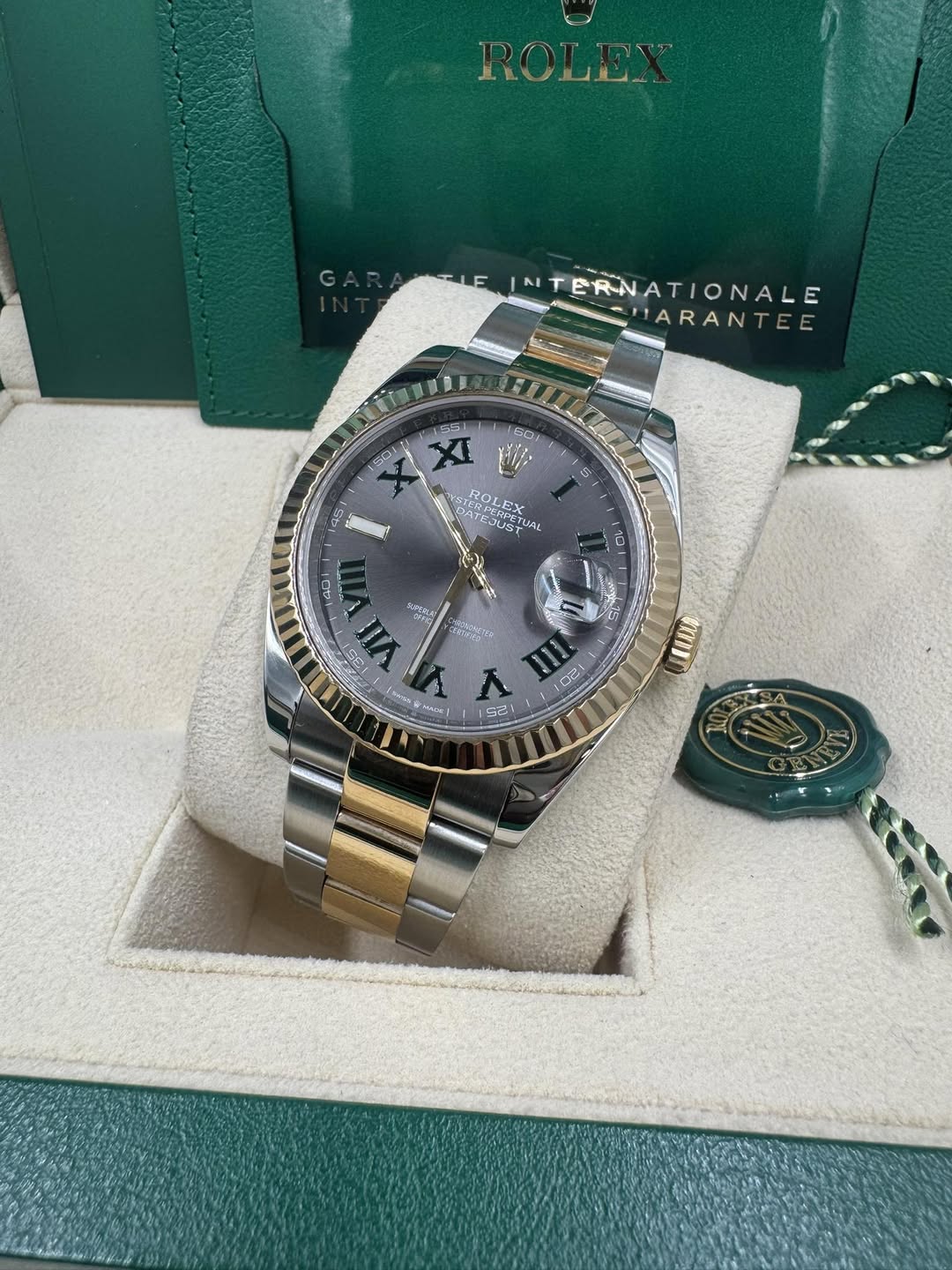 May be an image of wrist watch and text