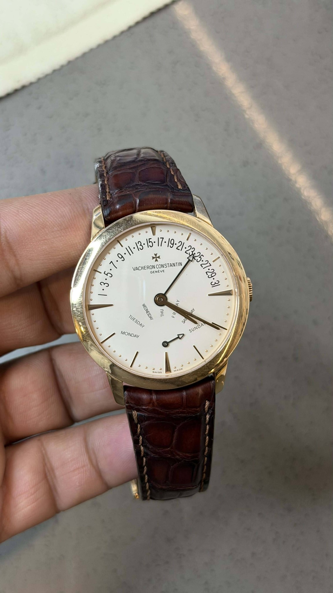May be an image of wrist watch and text