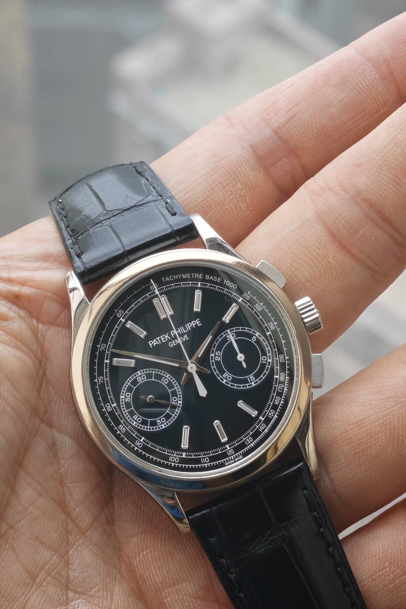 May be an image of wrist watch and text