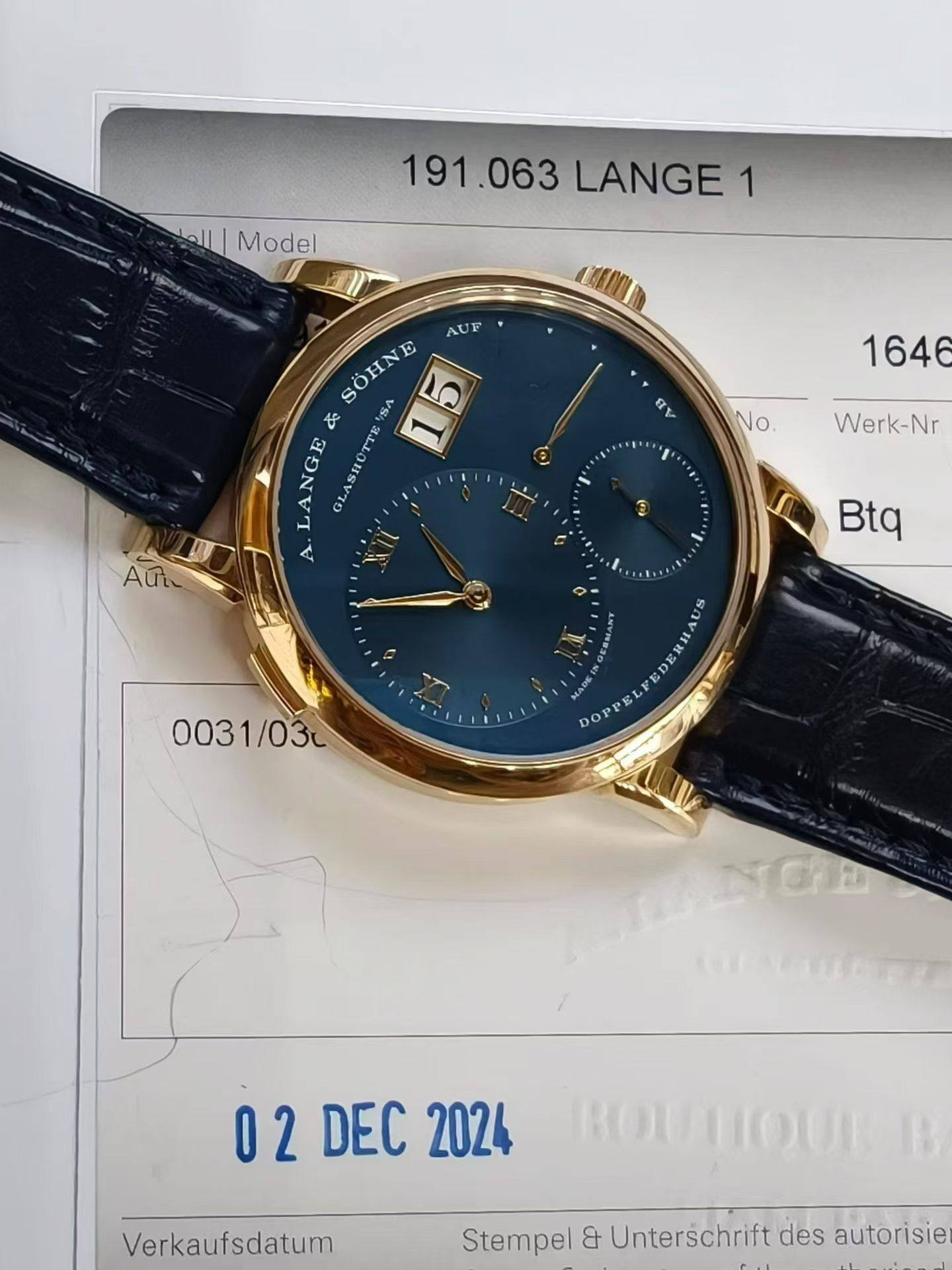 May be an image of digital watch and text that says 'اللما Model 191.063 LANGE 191.063LANGE 1 AUF SOHNE 15 な ۴۹۸ LANGE GLASHÜTTE TTE ش A. Rν 1646 NO Werk-Nr ၁ F Btq 0031/03c 003…