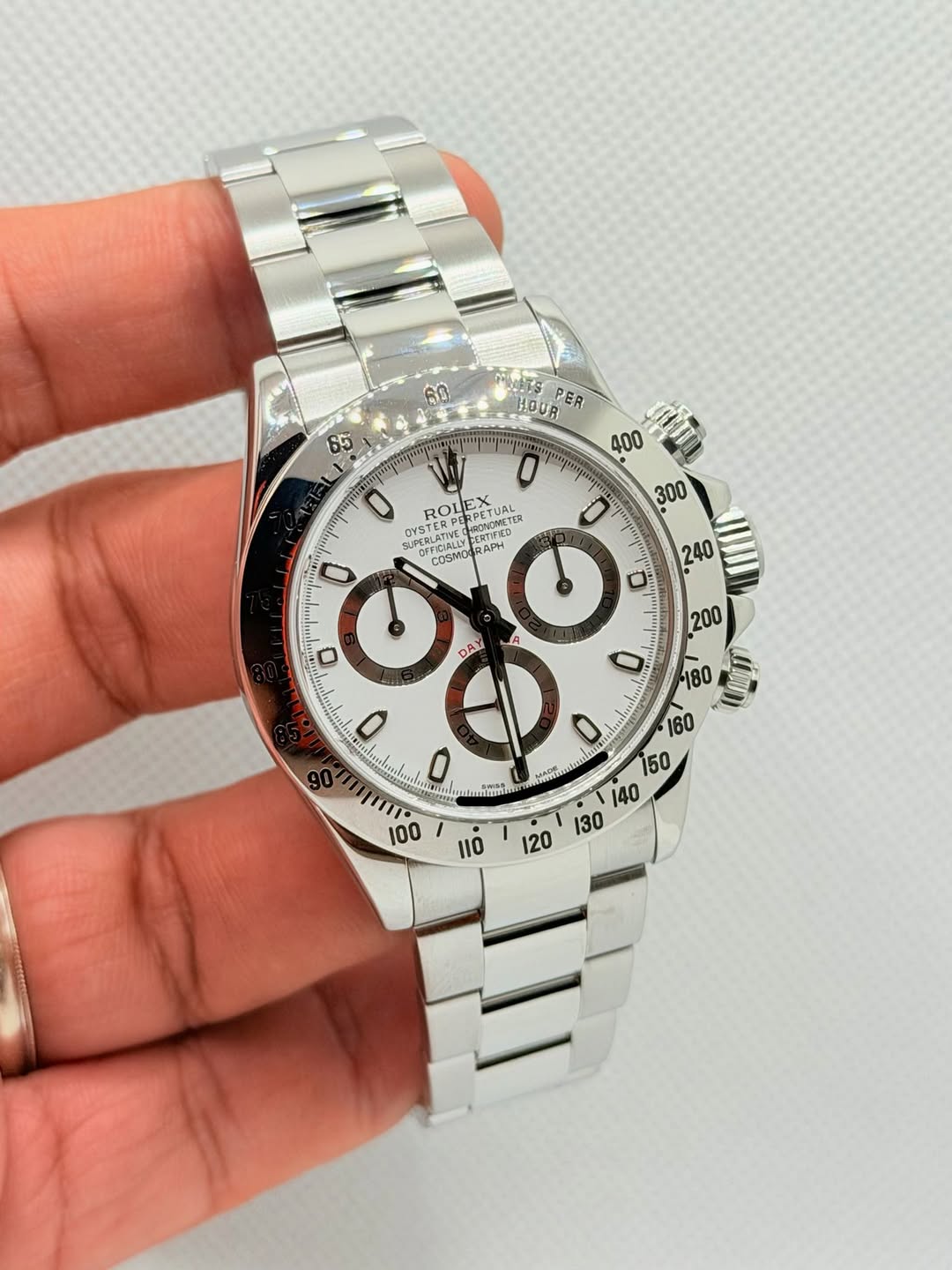 May be an image of wrist watch and text