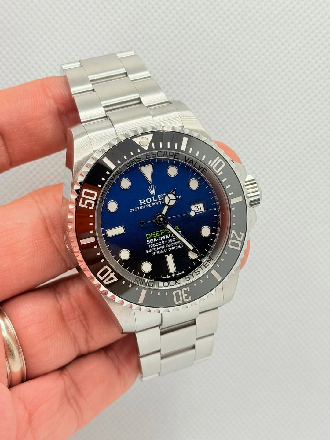 May be an image of digital watch and text that says '10 50 TE ROLE PCRPL PERPETU OYS OYSTER 31 SEA- SEA-D 0R=39C N390 SEA-DWELL २ TO 12800ft- #390K GOMM SUPERL MPTBK OFFIDIALLY…