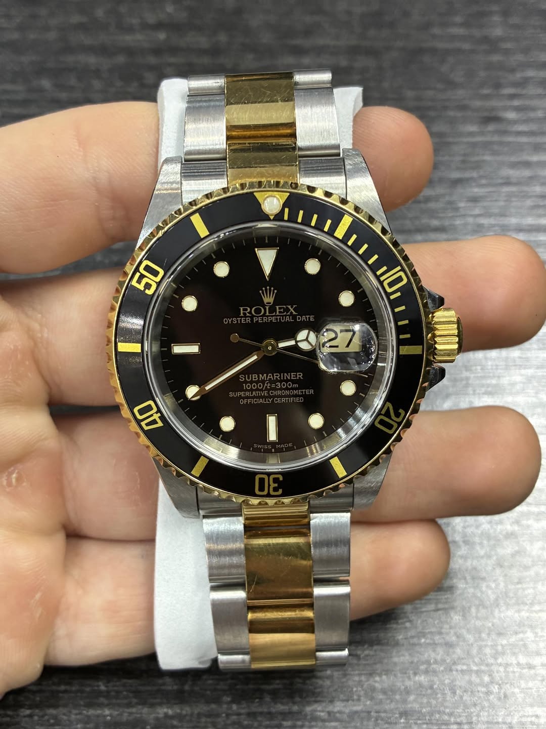 May be an image of wrist watch and text that says '0 0 7 40 I'