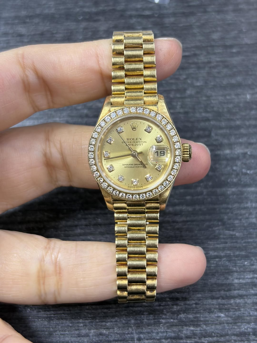 May be an image of wrist watch and text