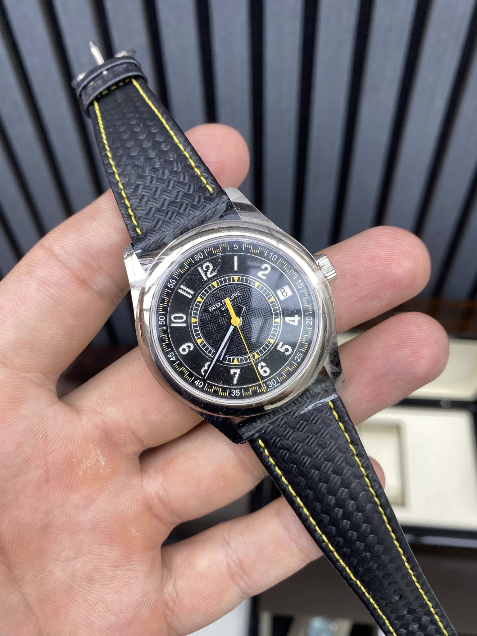 May be an image of wrist watch and text