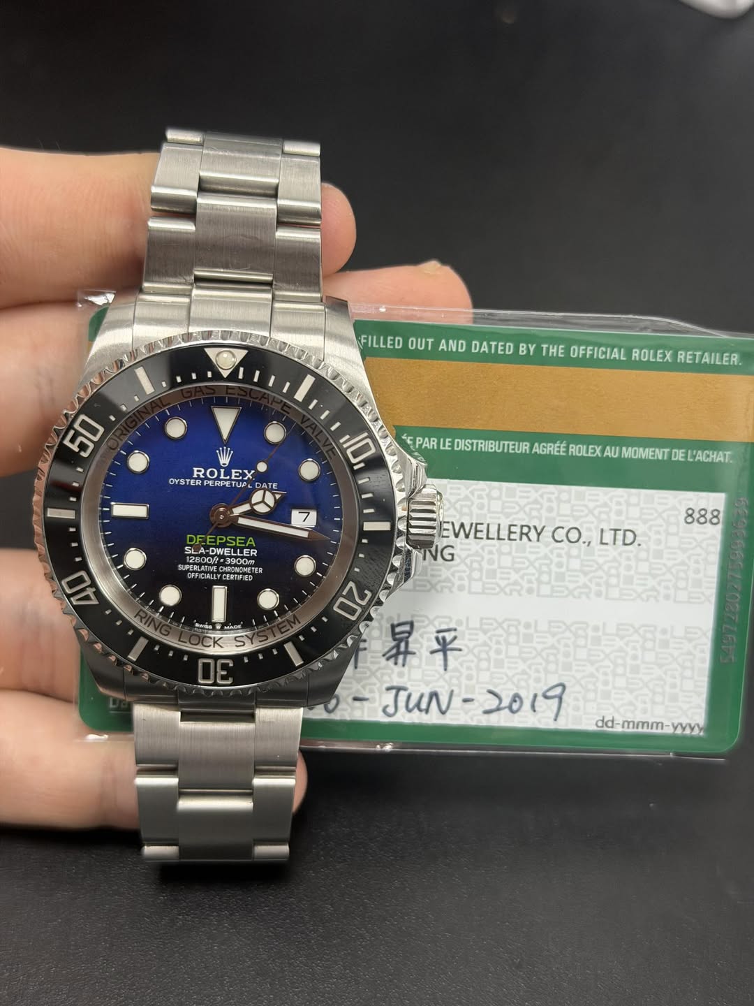 May be an image of wrist watch and text that says 'FILLED OUT AND DATED BY THE OFFICIAL ROLEX RETAILER. 50 ROLEX ROL OYSTER OYSTERPERIETUP Tue DA CATE EPAR I 10 DISTRIBUTEUR…