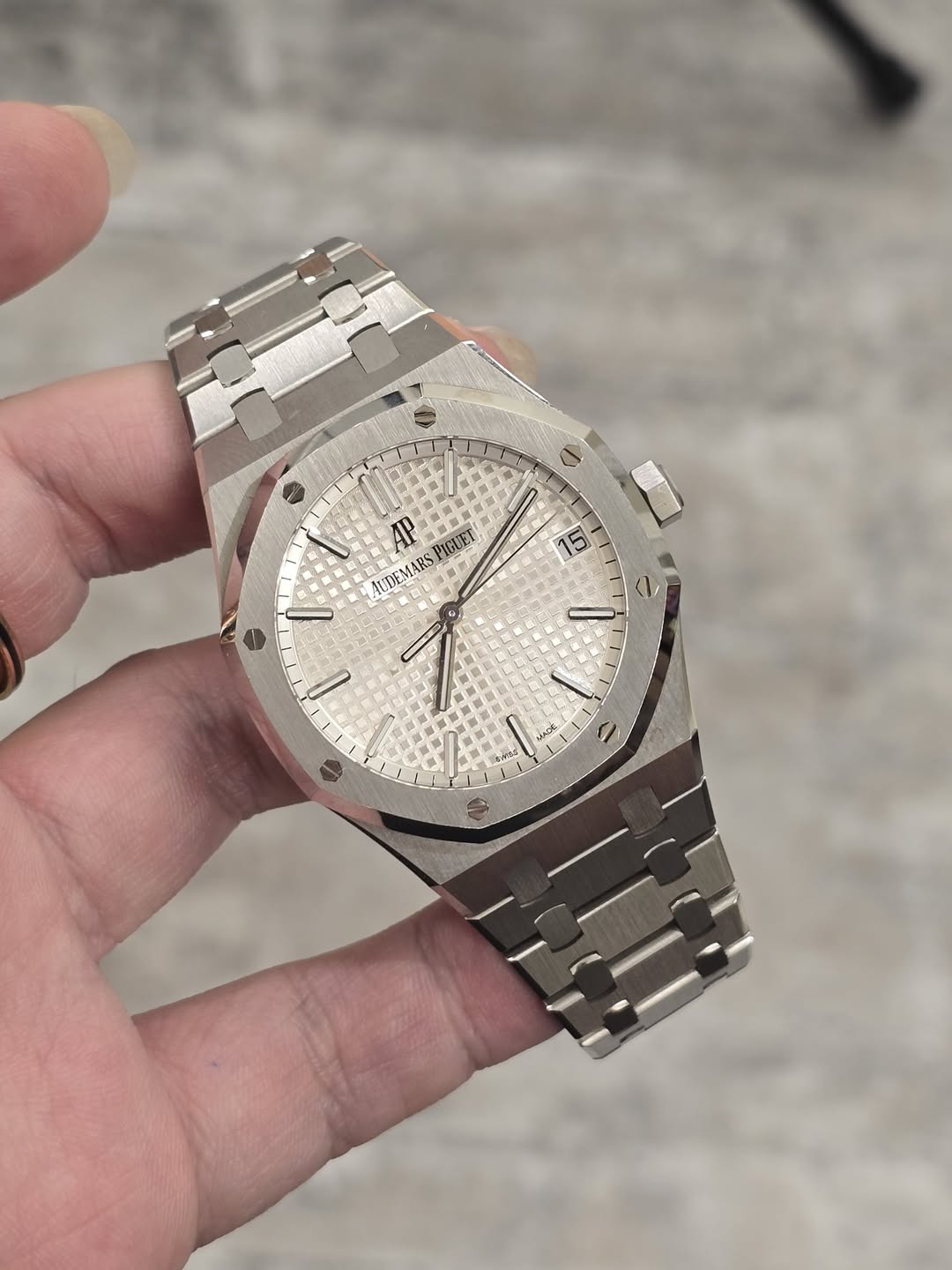 May be an image of wrist watch and text