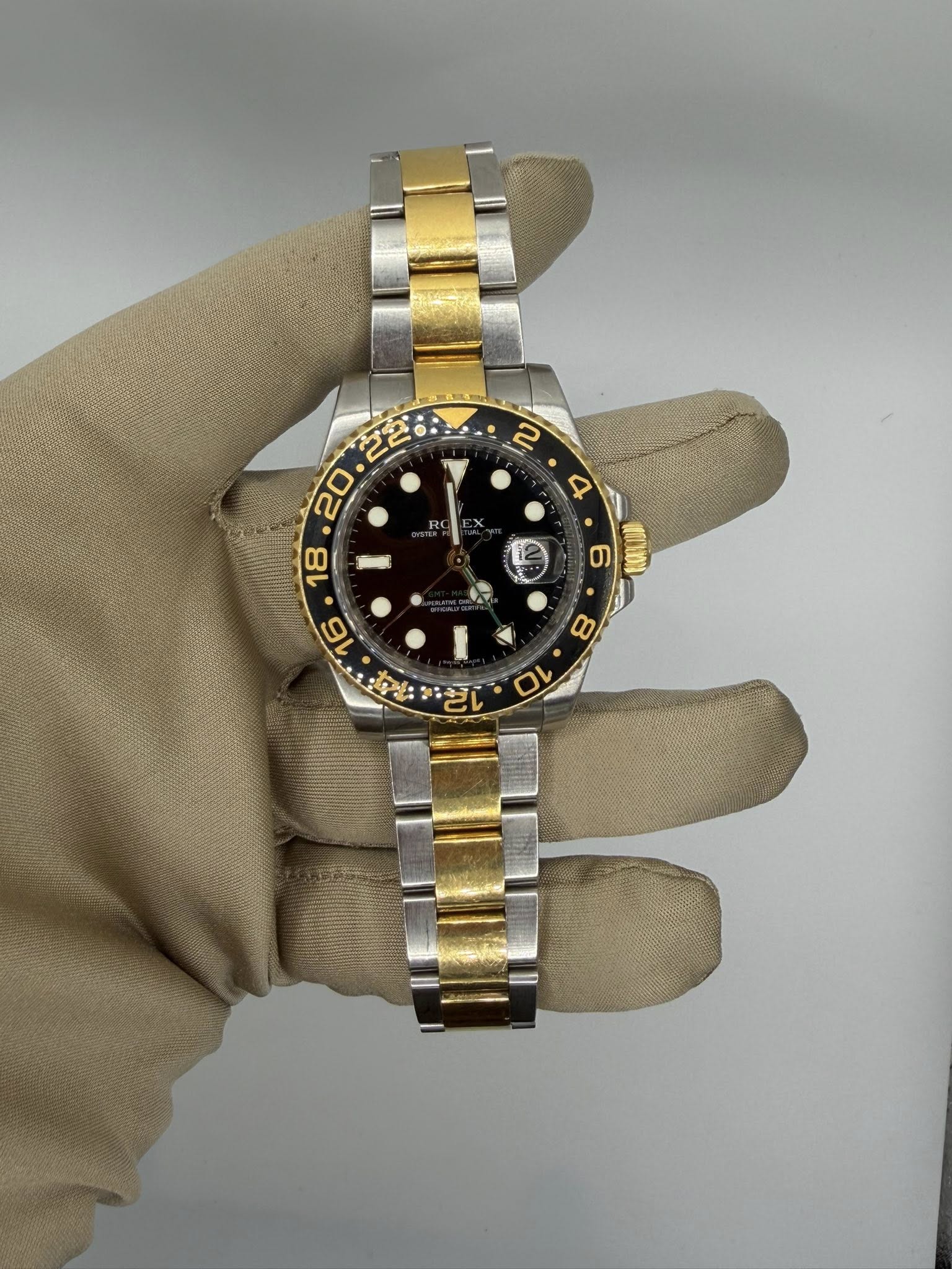 May be an image of wrist watch and text