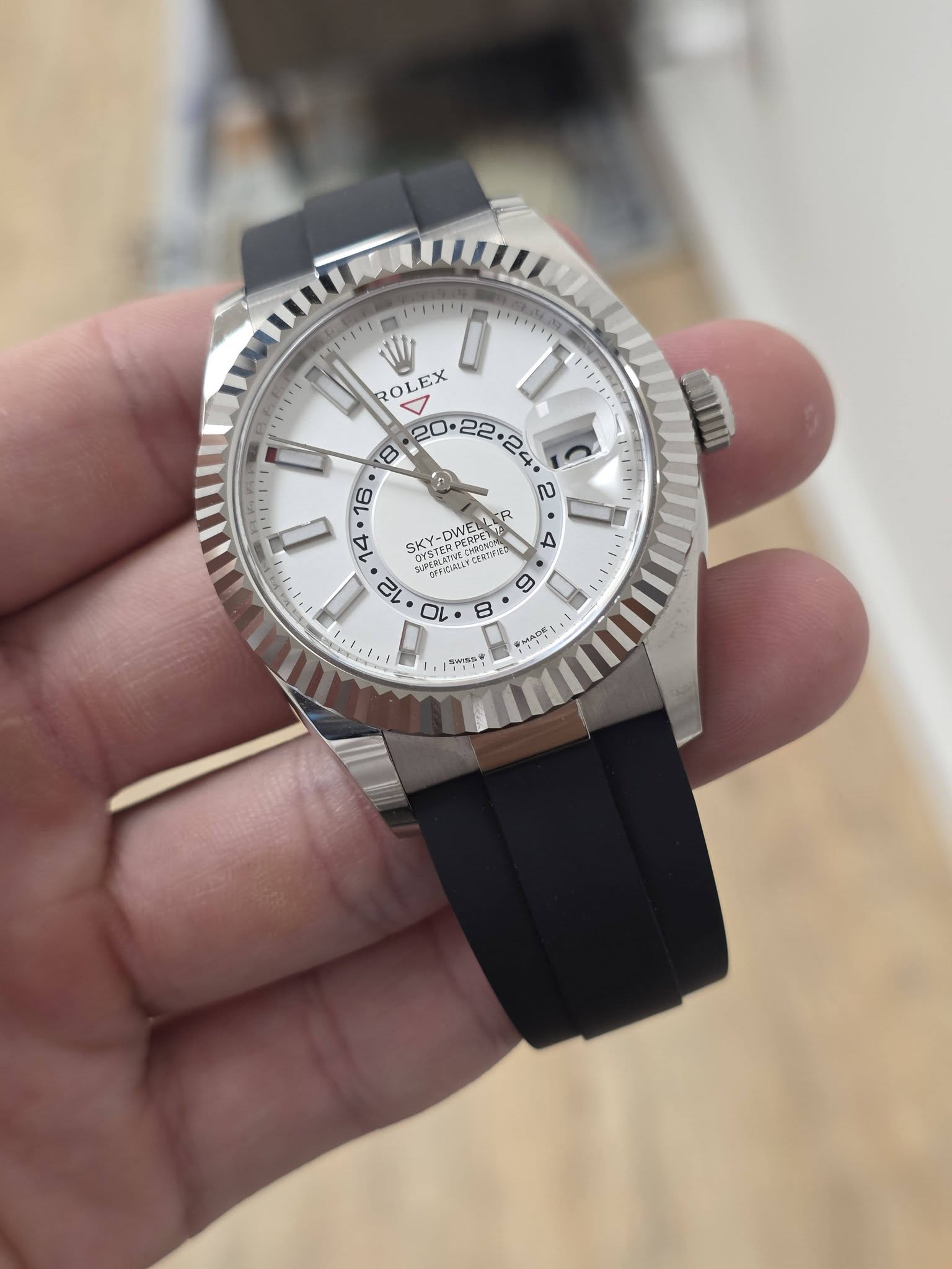 May be an image of wrist watch and text