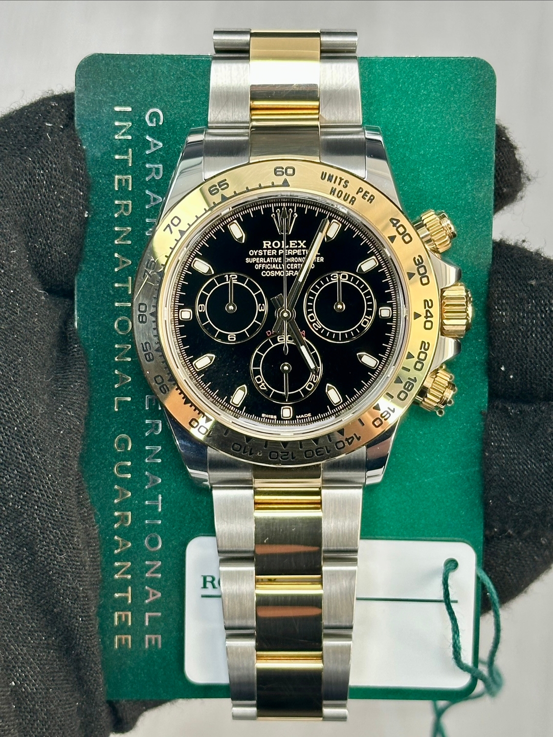 May be an image of wrist watch and text that says '60 SER INTERNAT GARAT 70 65 អក្រុស 60 9 ROLEX CINGLATIVE :HRONG OYSTER PERPET OFFICIALL CERT 6TE COSMO COSMO3R RA FER 12 () ២…