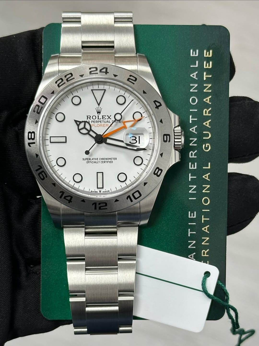 May be an image of wrist watch and text that says '24 2 20 O O WI ROLEX EX PERPETUAL BLODER AT 18 SUPERLATIVE CHRONOMETER OFFICIALLYCERTFIED O I ค MAAC 4 9 31 6 1WWO o 8 O0…