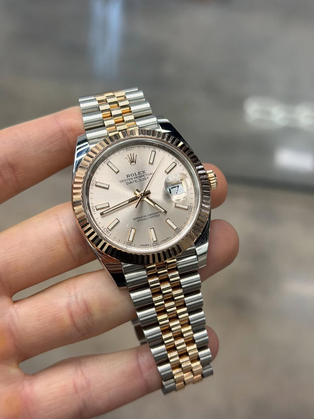 May be an image of wrist watch and text