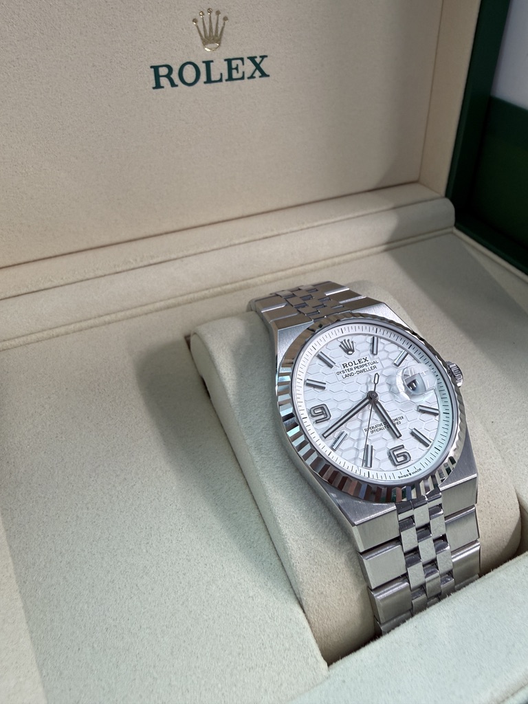 May be an image of wrist watch and text