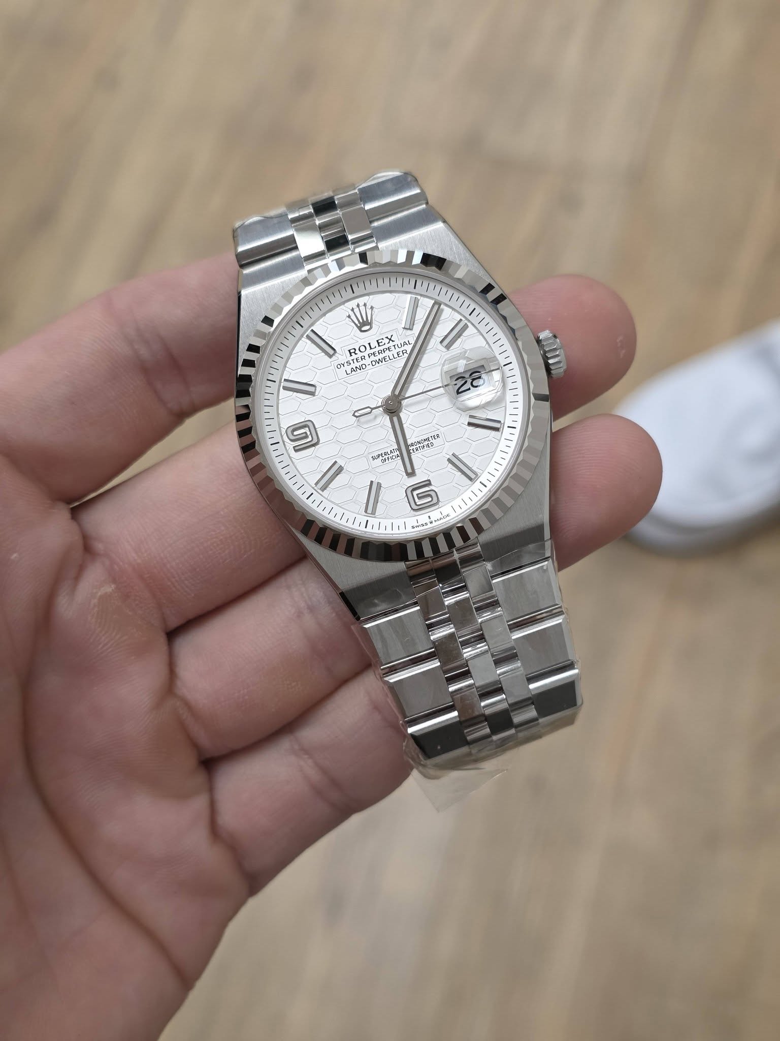 May be an image of wrist watch and text
