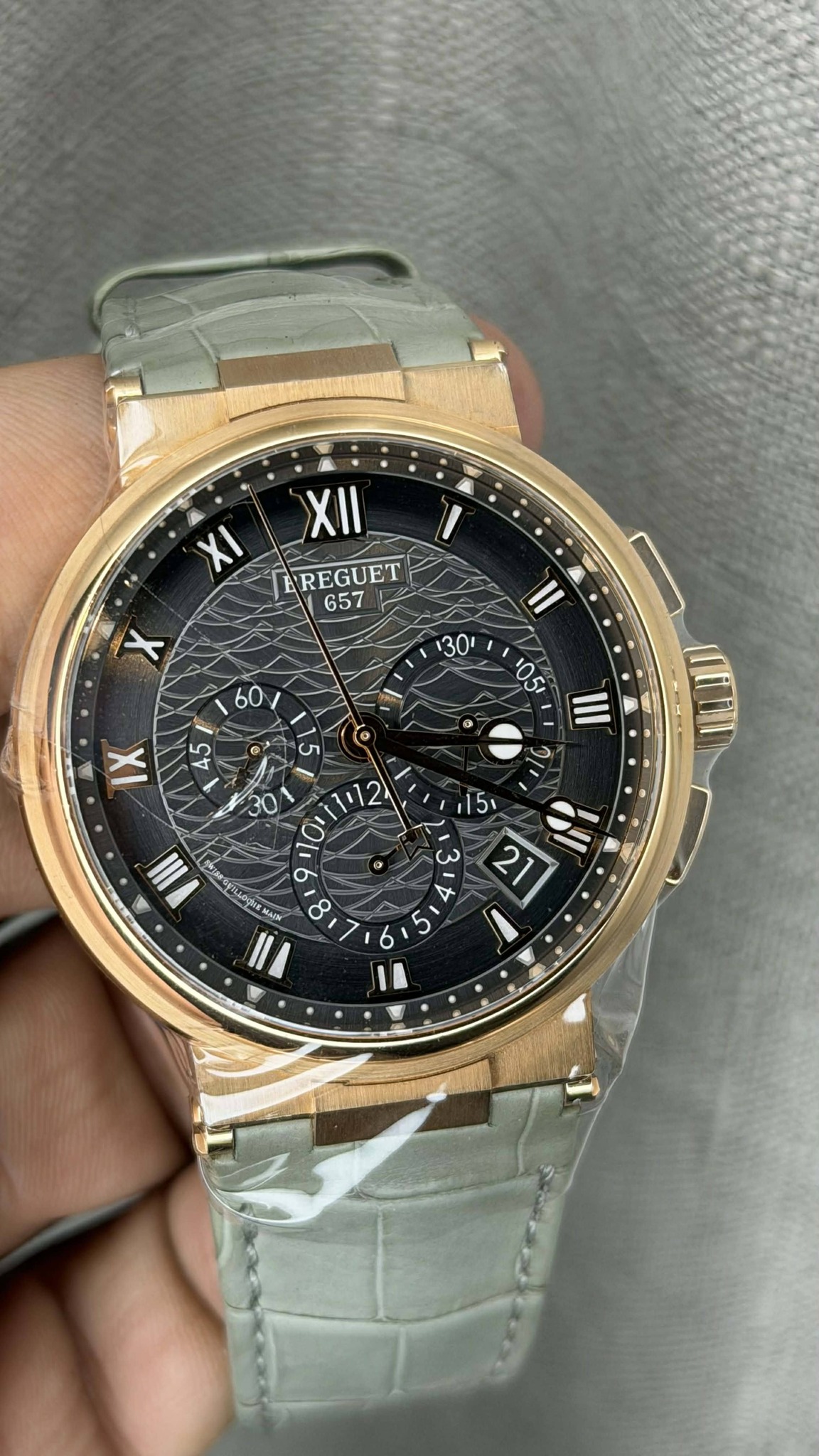 May be an image of digital watch and text that says 'XII EREGUET 657 II 30 60 I 45 ០ ® 5 0 05 III IX မ 10 12 III 30 0 a 8 ١ ,15 ى 21 4 11'