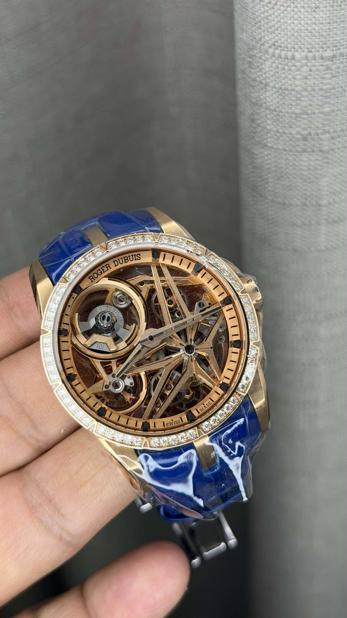 May be an image of wrist watch and text