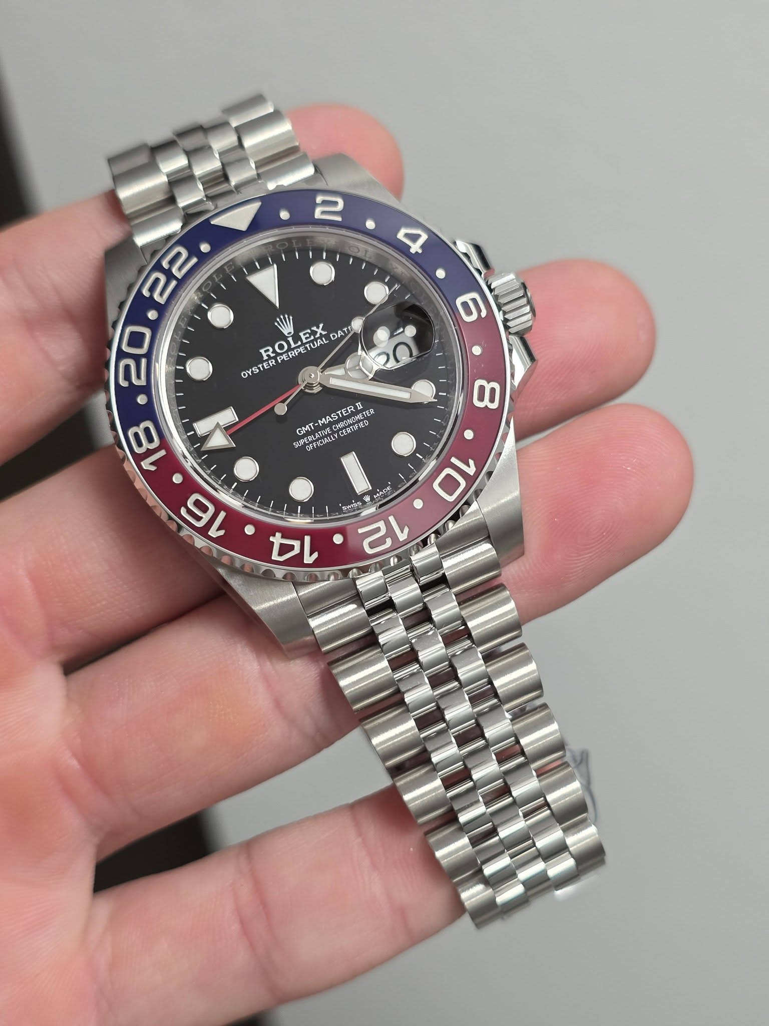 May be an image of wrist watch and text