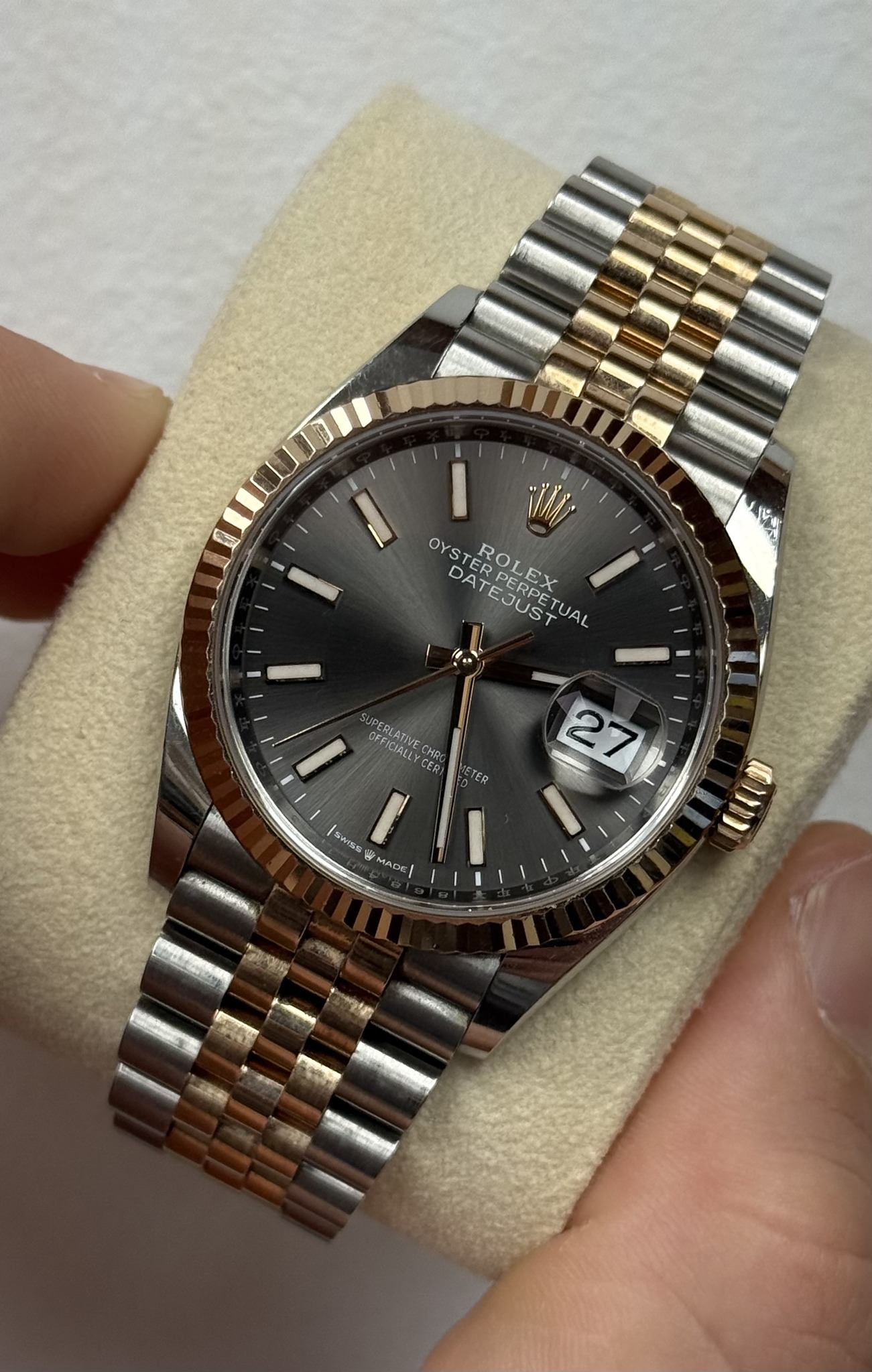 May be an image of wrist watch and text